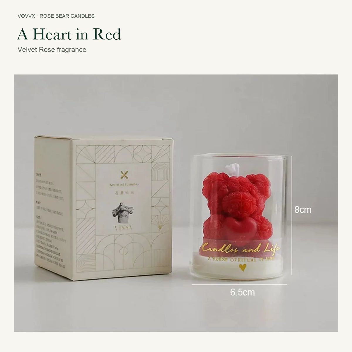 Original red rose-bear candle beside its cream and gold printed box, with 8 cm height and 6.5 cm width markings.