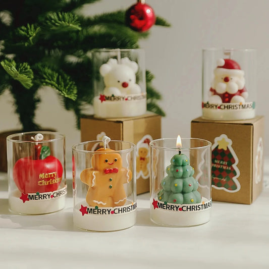 Original Christmas glass cup candle collection with apple, gingerbread, green tree, white reindeer, and Santa designs.