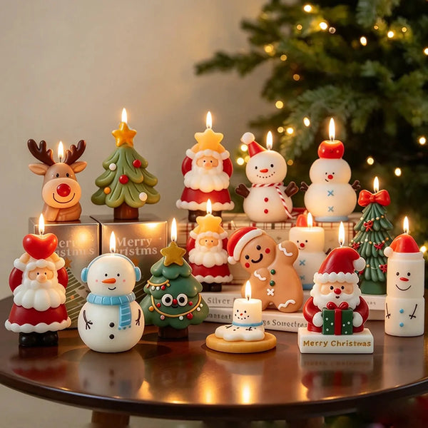 Christmas character candle collection with original packaging on a wooden table beside a Christmas tree.