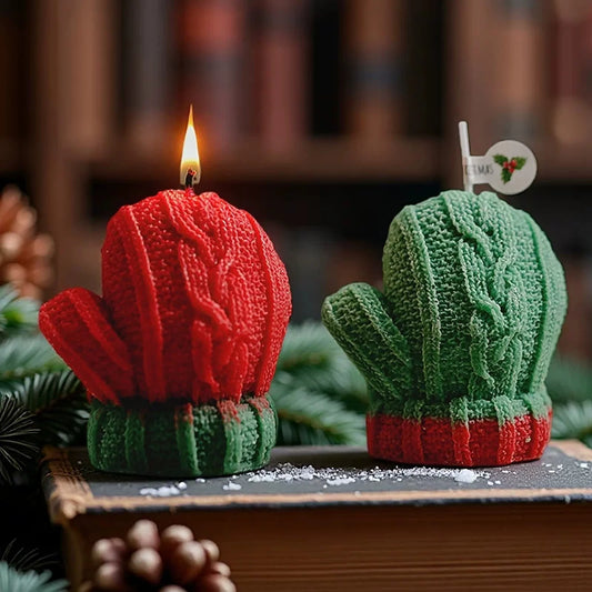 Original red and green mitten-shaped candles with contrasting cuffs, knit texture, and original tag in a seasonal setting.
