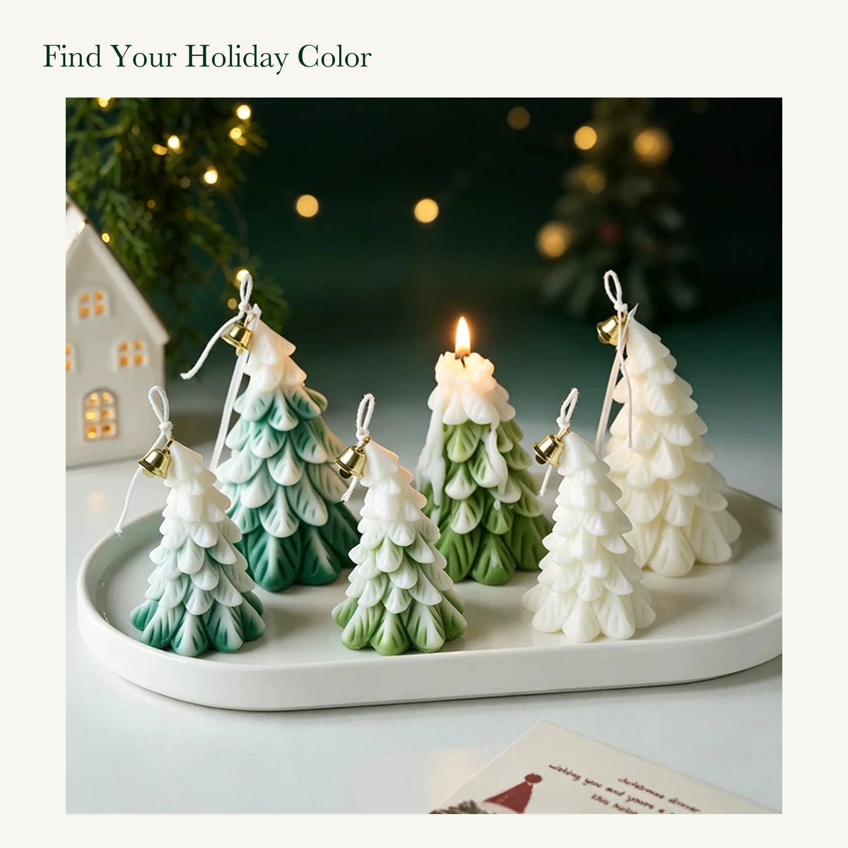 Green, olive green, and white Christmas tree candles in two sizes on a white tray.