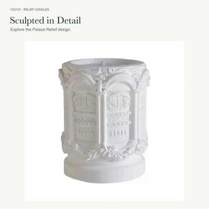 Original white Palace Relief candle showing raised columns, scrollwork, lettering, and its original surface texture.