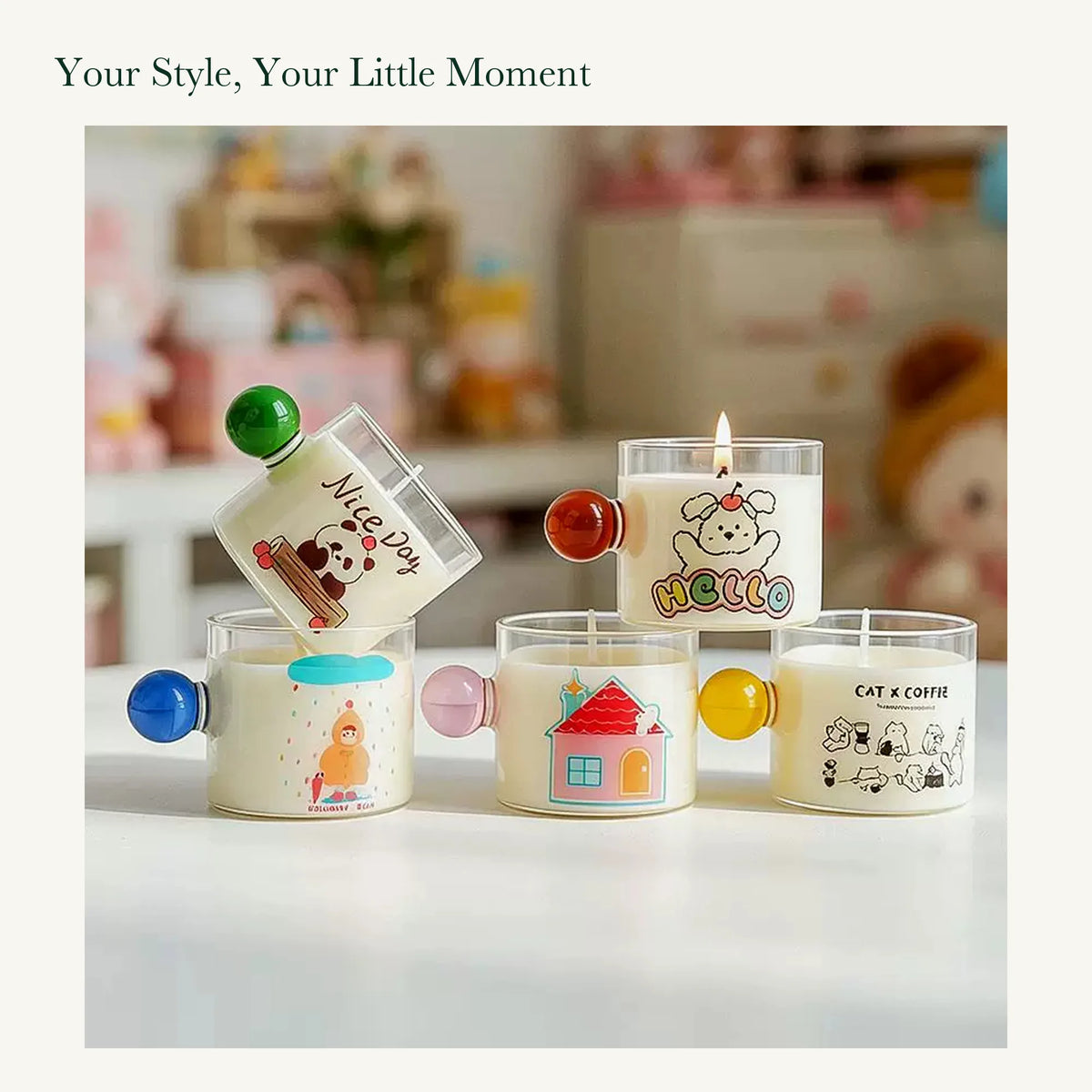 Panda, dog, rainy-day, house, and cat candles with their original colored glass handles in a tabletop display.