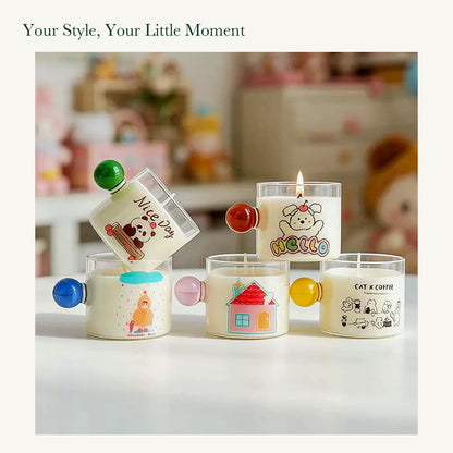 Panda, dog, rainy-day, house, and cat candles with their original colored glass handles in a tabletop display.