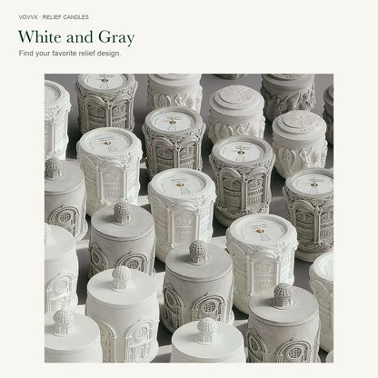 Original Palace Relief, Angel Relief, and Roman Architecture candles arranged in white and gray finishes.