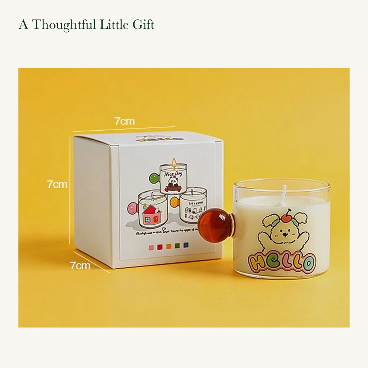 Original dog-design glass candle beside its printed white box labeled 7 by 7 by 7 centimeters.