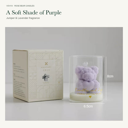 Original purple rose-bear candle beside its cream and gold printed box, with 8 cm height and 6.5 cm width markings.